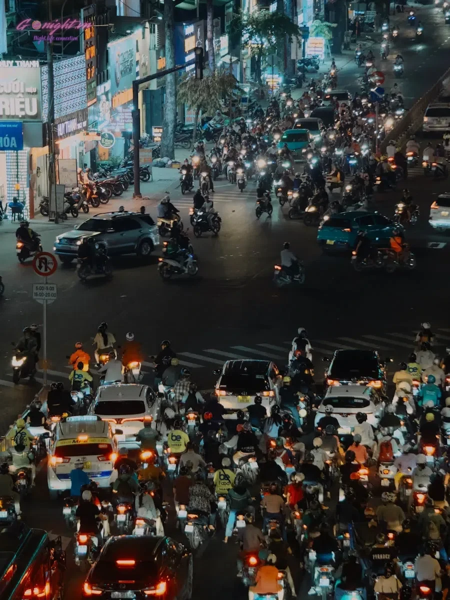 Essential Safety Tips for International Travelers in Vietnam 2 Vibrant night scene showing dense traffic in a Vietnamese city with cars and motorbikes.