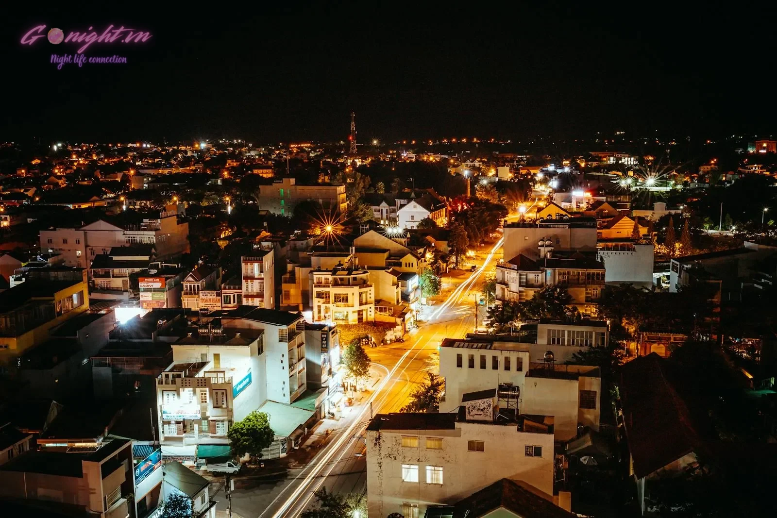 Essential Safety Tips for International Travelers in Vietnam 1 A vibrant aerial view of Kon Tum, Vietnam at night, showcasing lively city lights and bustling streets.