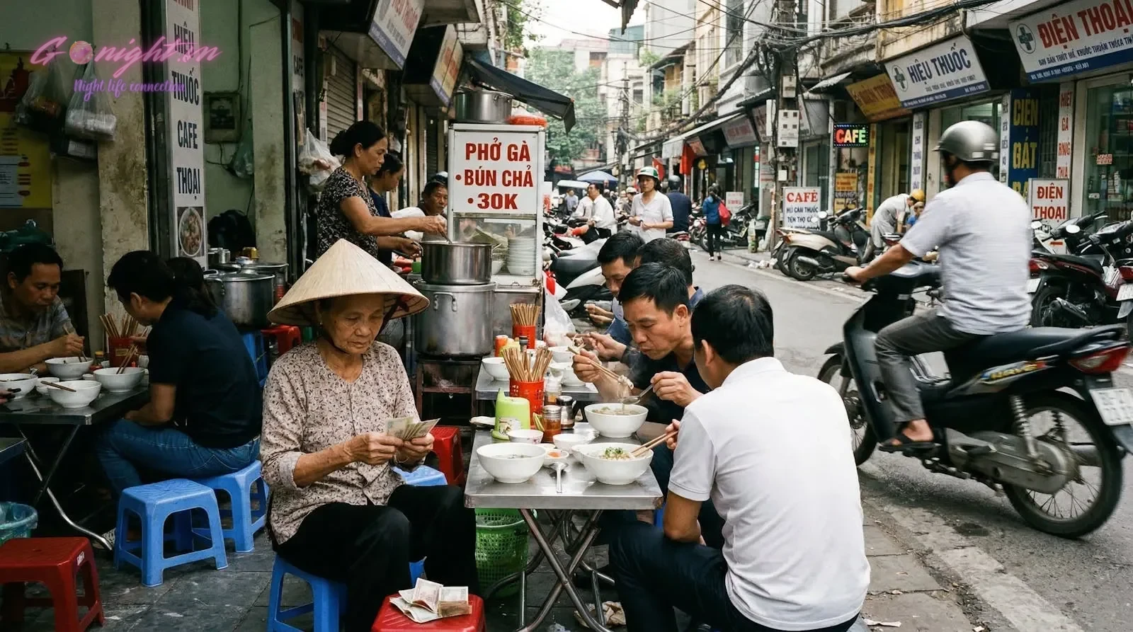 Essential Safety Tips for International Travelers in Vietnam 4 Vibrant street food scene in Hanoi's Old Quarter with locals enjoying Vietnamese cuisine.