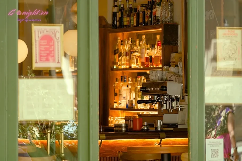 Bottles of alcohol displayed behind a bar counter.