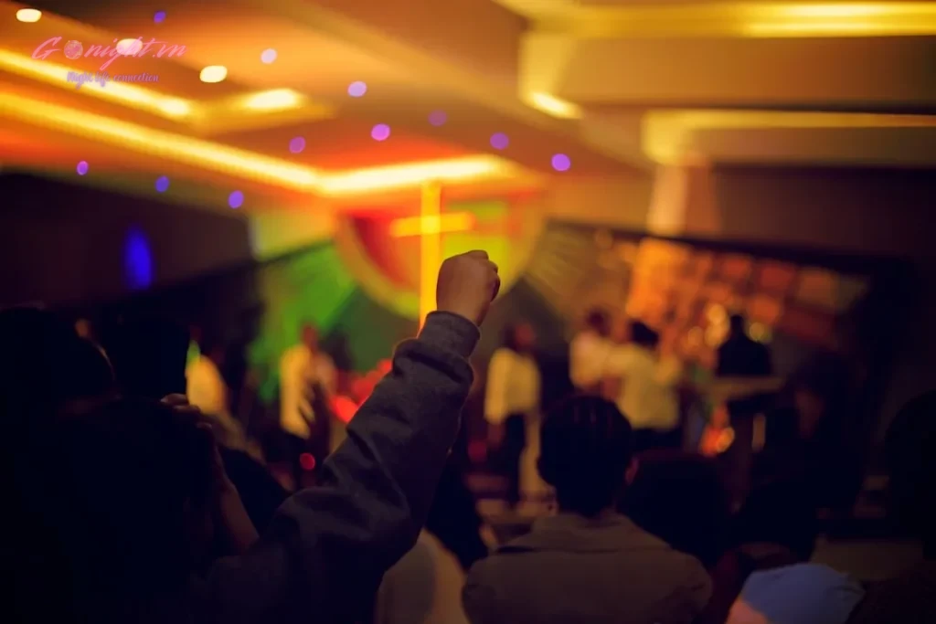 person raising fist in air