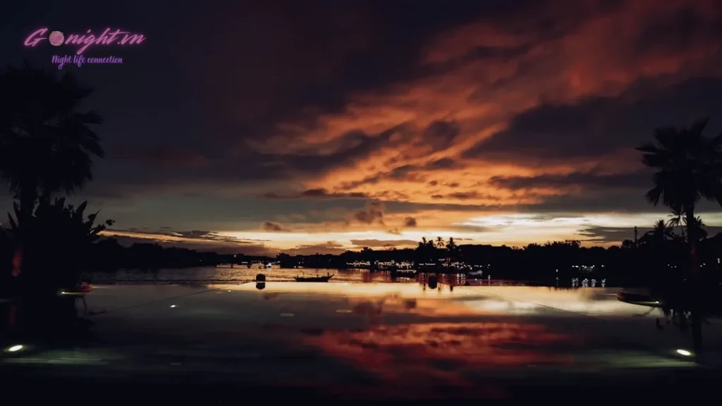 the sun is setting over a body of water