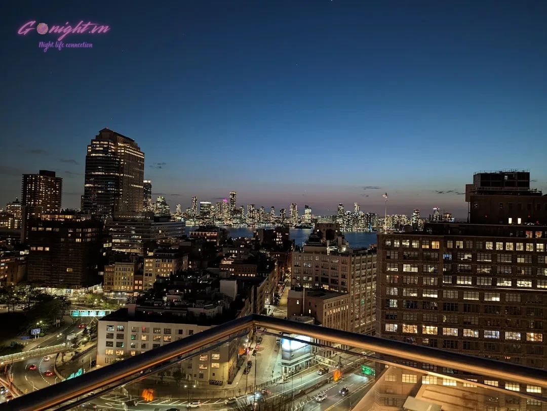 A view of a city at night from a rooftop