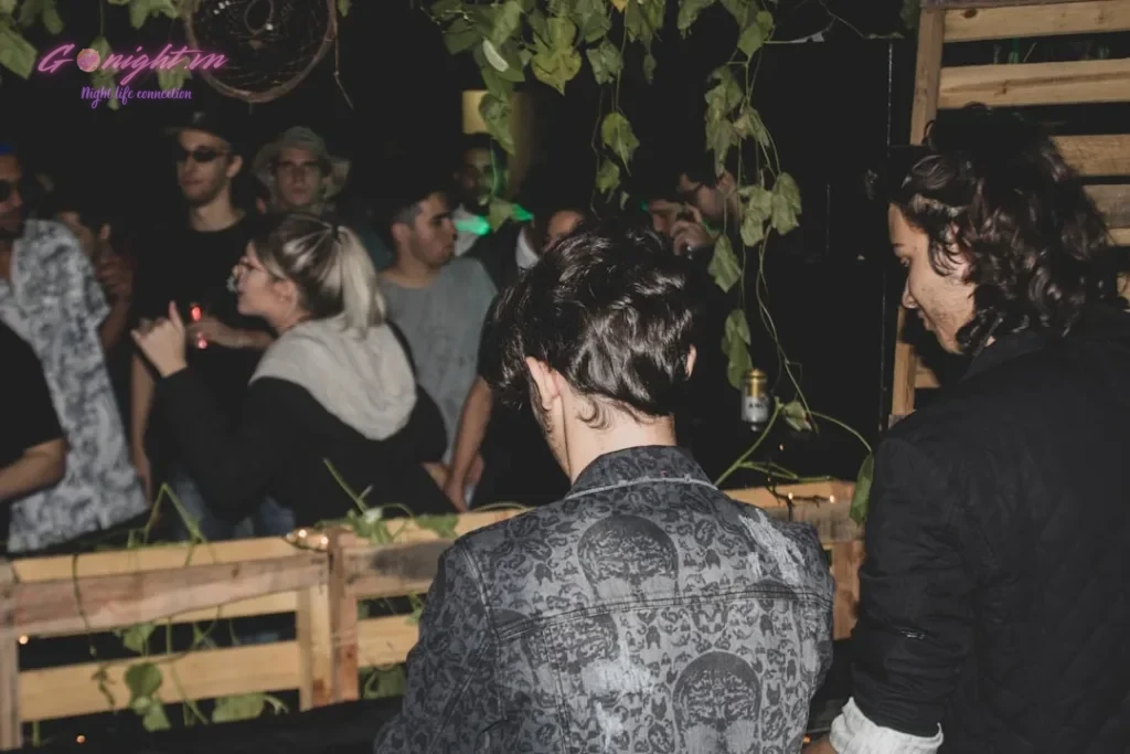 a group of people standing around each other