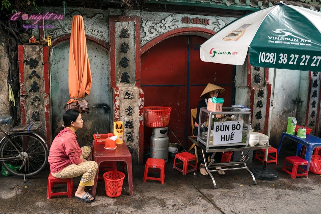 vietnamese night market street food stall with people