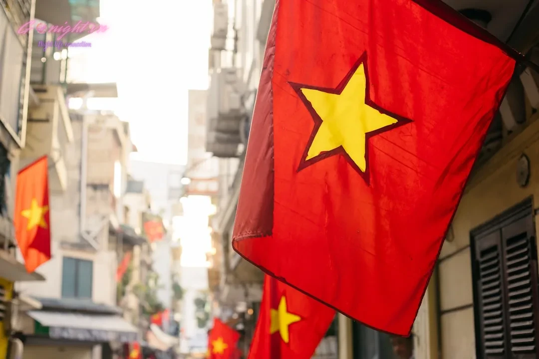 Sing Your Heart Out: Essential Tips for an Unforgettable Karaoke Night in Vietnam 2 a red and yellow flag hanging from the side of a building