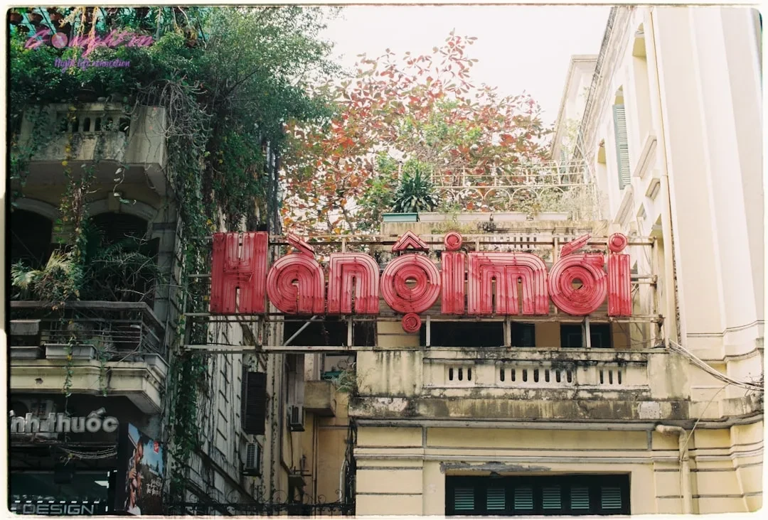 Choosing Your Vibe: A Guide to Hanoi's Nightlife by Music Genre 5 Red sign on old building with overgrown plants