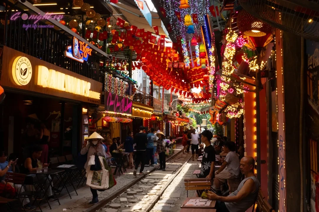 Beyond the Old Quarter: A Guide to Exploring Hanoi's Diverse Nightlife Districts 1 Bustling street market with colorful lanterns and people.