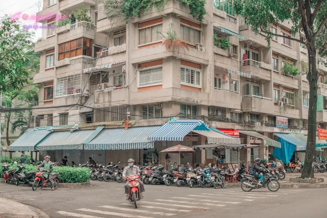 people riding bicycles on road near building during daytime