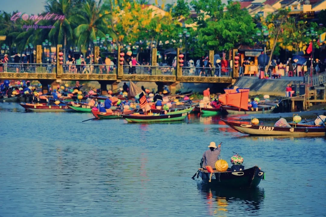 a group of people in small boats on a river