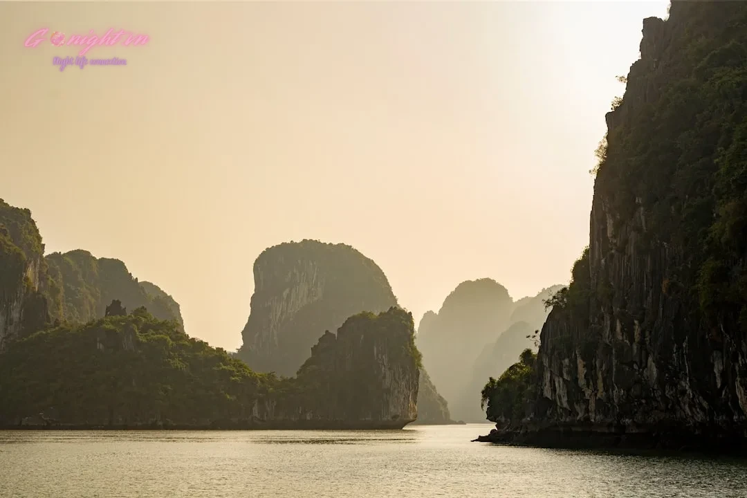 Hanoi After Dark: A Foreigner's Guide to the Best Karaoke Bars in Cầu Giấy District 1 a large body of water surrounded by mountains