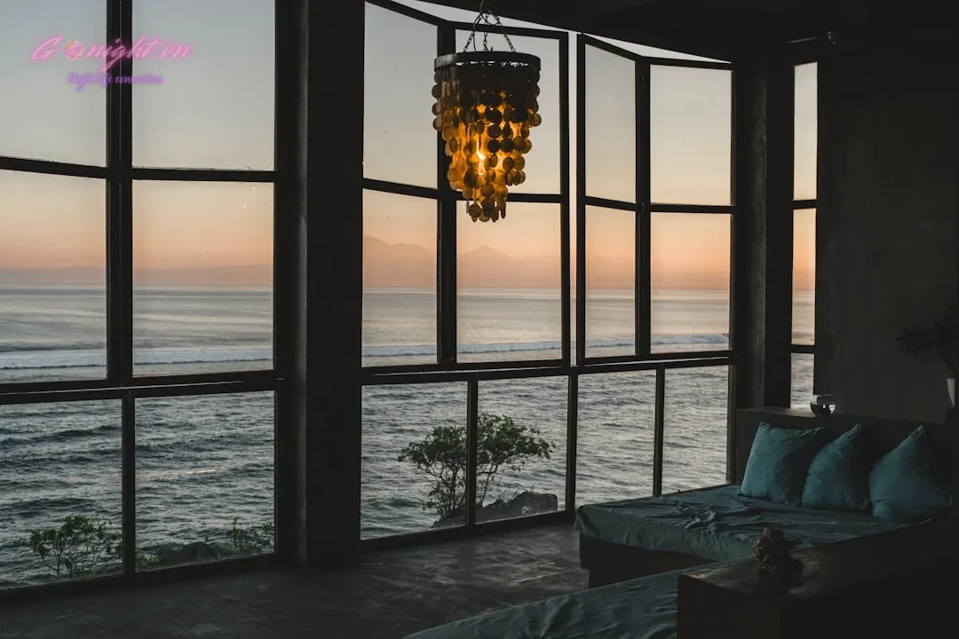 Sunset Sessions: 7 Best Rooftop Bars in Da Nang for Breathtaking Ocean Views 9 Modern room with ocean view at sunset