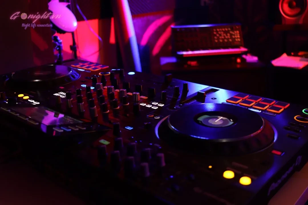 a dj's turntable in a dimly lit room