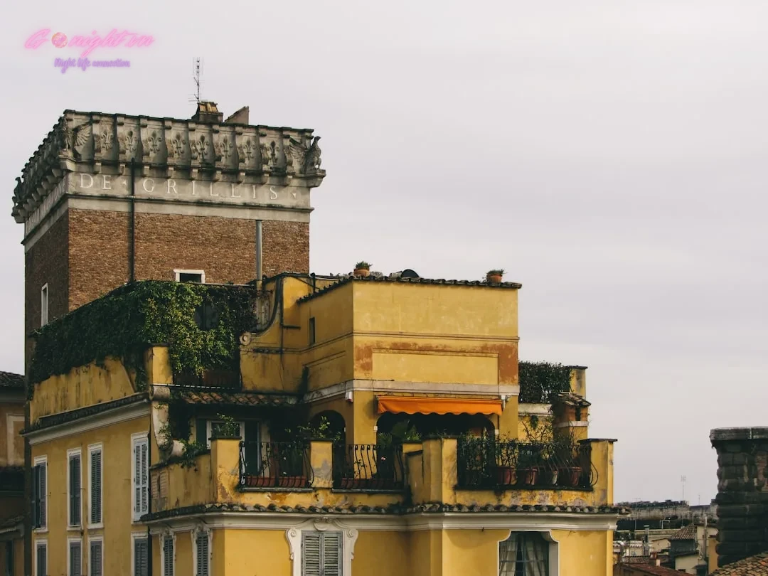 a yellow building with a balcony and balconies