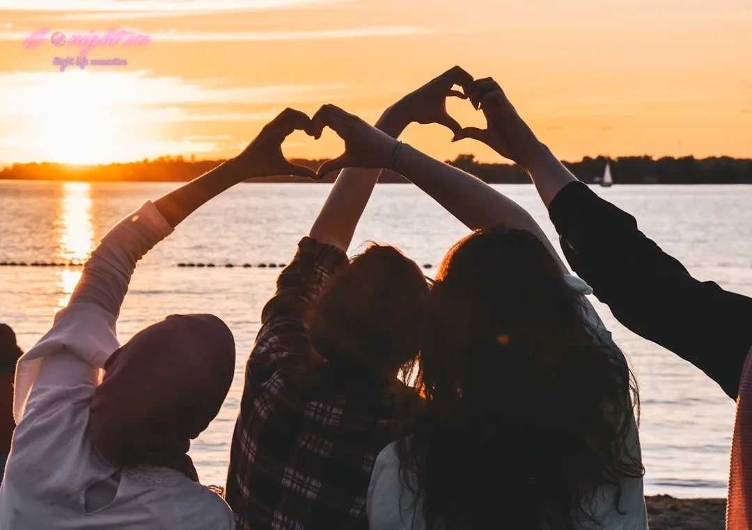 Top 5 Beach Clubs in Nha Trang: Your Ultimate Guide to Coastal Nightlife 7 people near body of water during golden hour