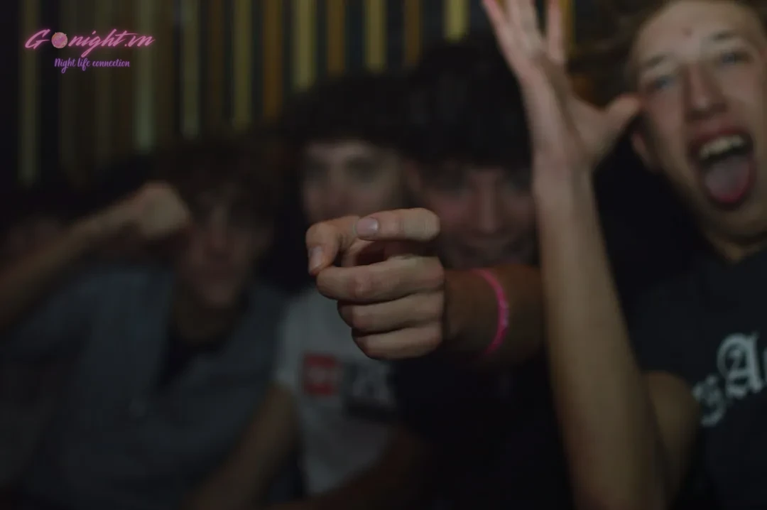 Group of friends pointing and making faces