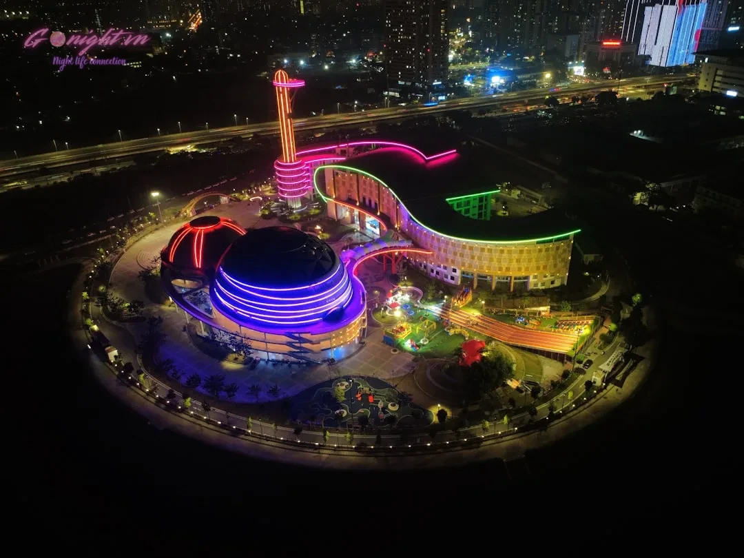 Modern building illuminated with colorful lights at night