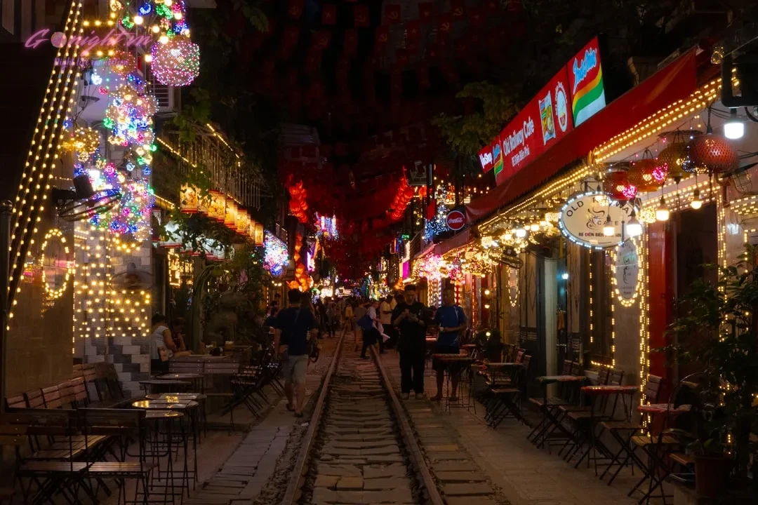 Night street lined with restaurants and colorful lights