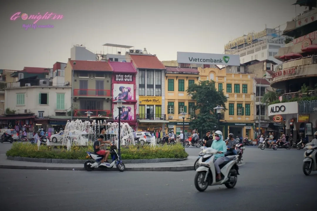 Top 7 Nuru Massage & Spa Centers in Hanoi: A Guide to Unique Relaxation Experiences 8 a group of people riding scooters down a street