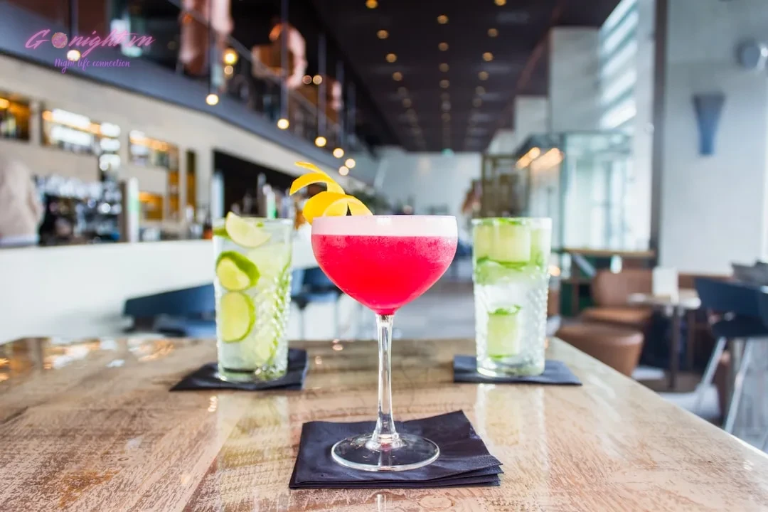 Top 7 Cocktail Bars in Ho Chi Minh City's District 1 for a Sophisticated Evening 7 long-stem wine glass filled with red liquid