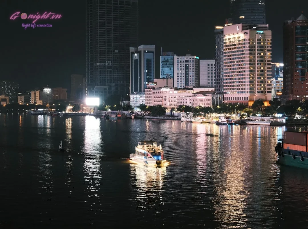 Ho Chi Minh City's Sky-High Escapes: Top 7 Rooftop Bars with Breathtaking Views 1 City skyline with boats on the water at night