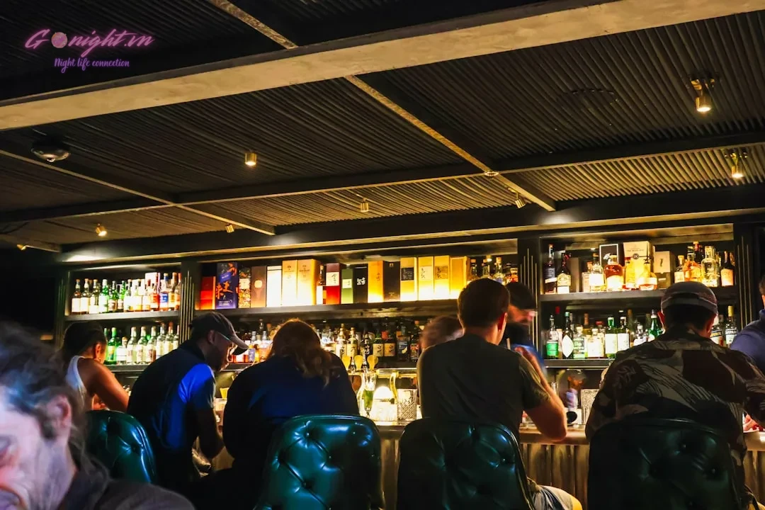 A group of people sitting at a bar