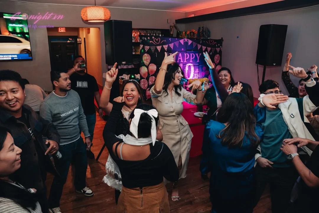 A group of people dancing in a room