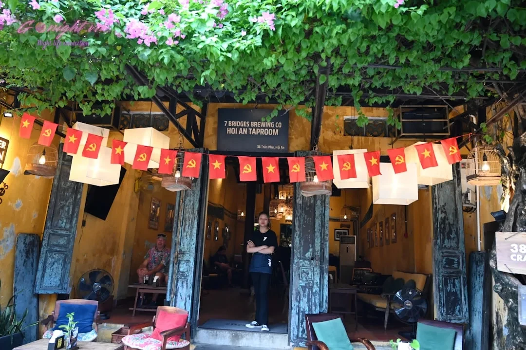 A storefront decorated with red and white lanterns and flags.