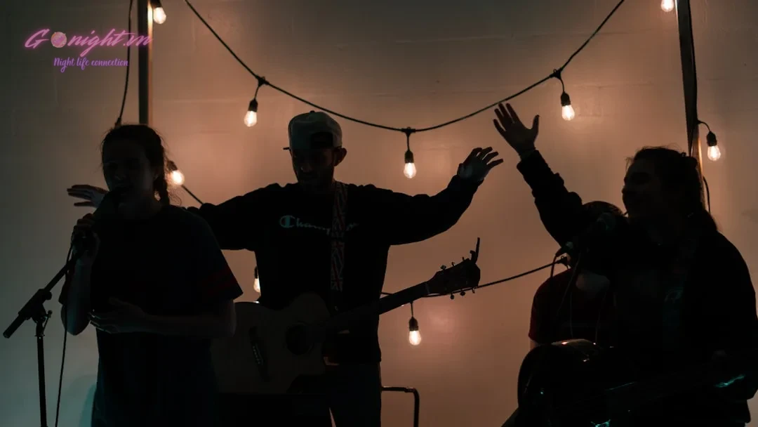 man in black jacket playing guitar