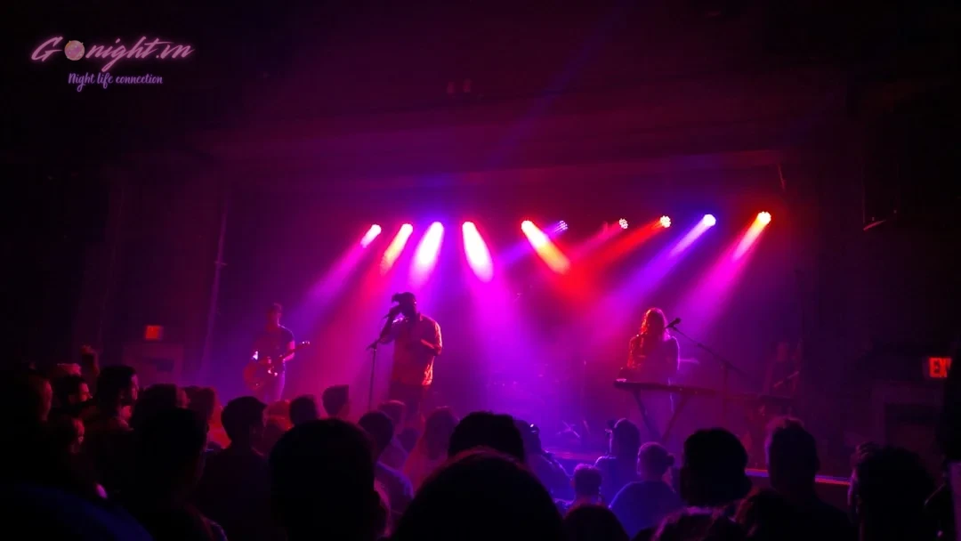 people watching band performing on stage