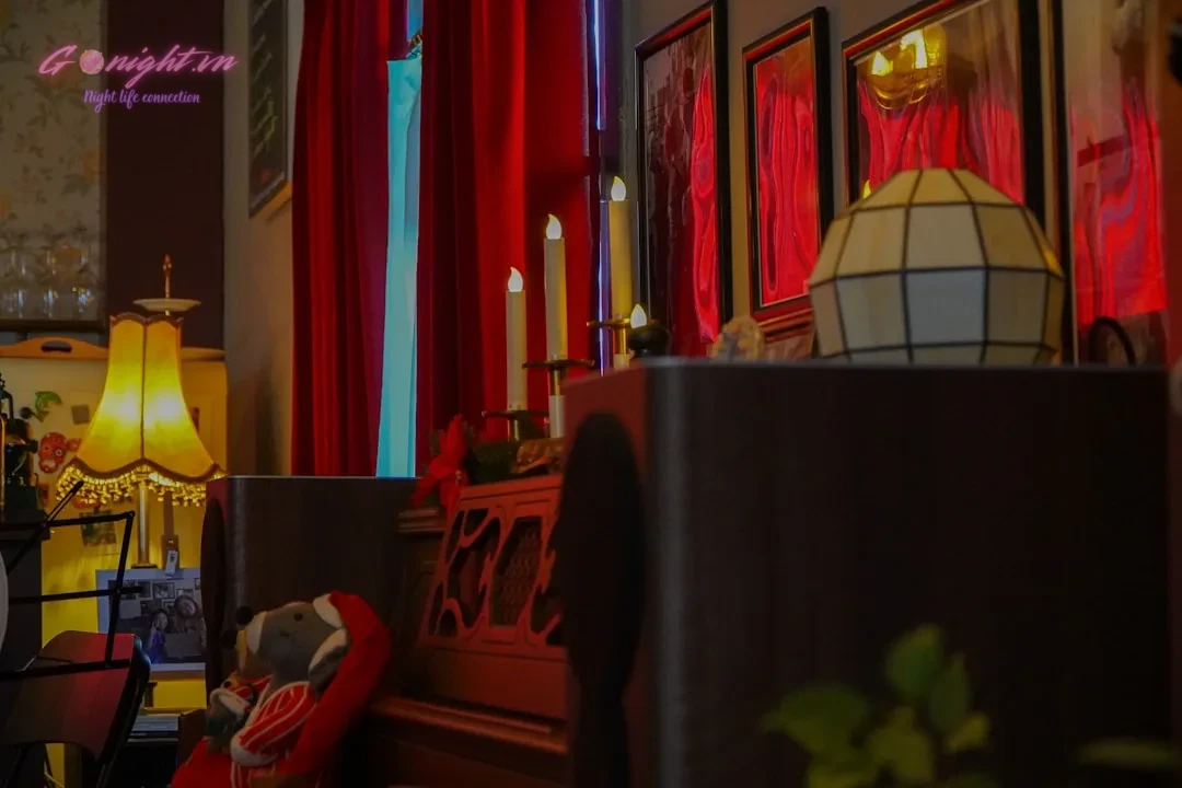a living room filled with furniture and red curtains