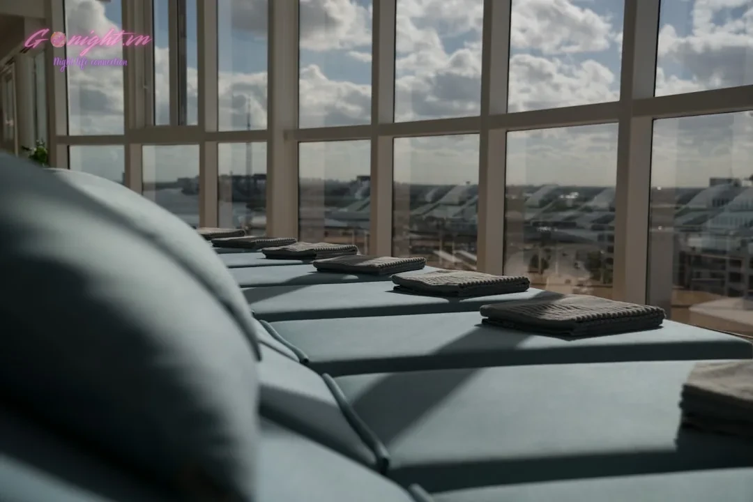 a row of couches sitting in front of a window