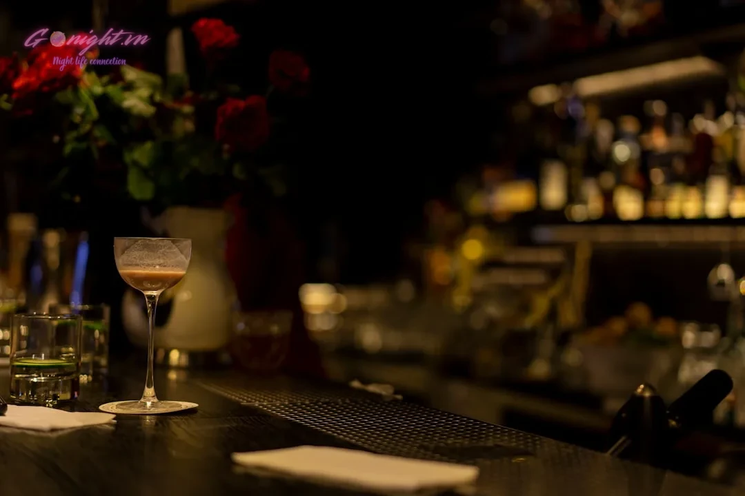 Top 7 Cocktail Bars in Ho Chi Minh City's District 1 for a Sophisticated Evening 6 clear wine glass on table
