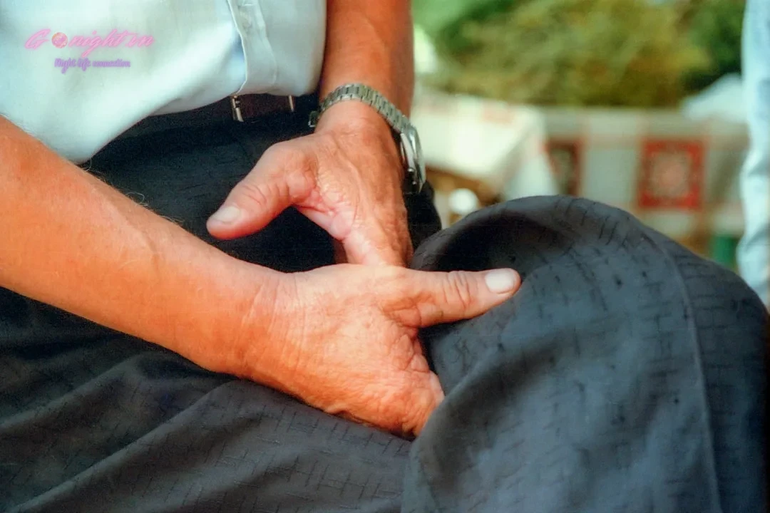 a person with their hands on their knees
