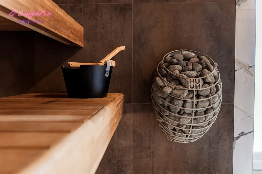 Top 7 Luxury Massage & Spa Centers in Binh Chanh: Ultimate Relaxation Escapes 9 Sauna heater with stones and wooden bucket