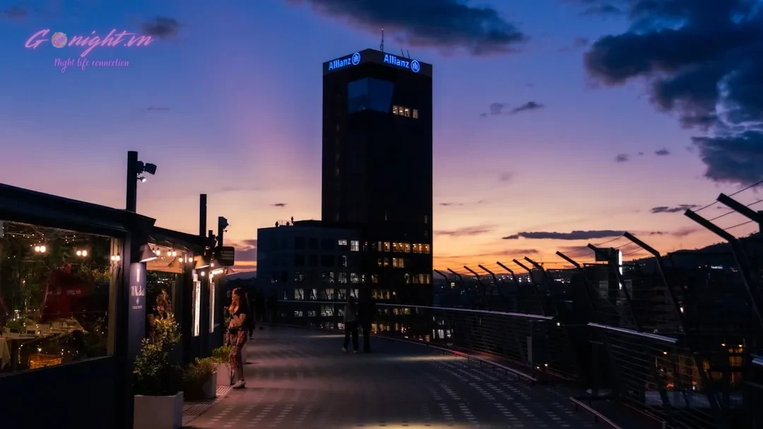 Beyond Pho: A Foreigner's Guide to Navigating the Dress Code at Vietnam's Upscale Clubs and Rooftop Bars 1 A city street with a clock tower in the background