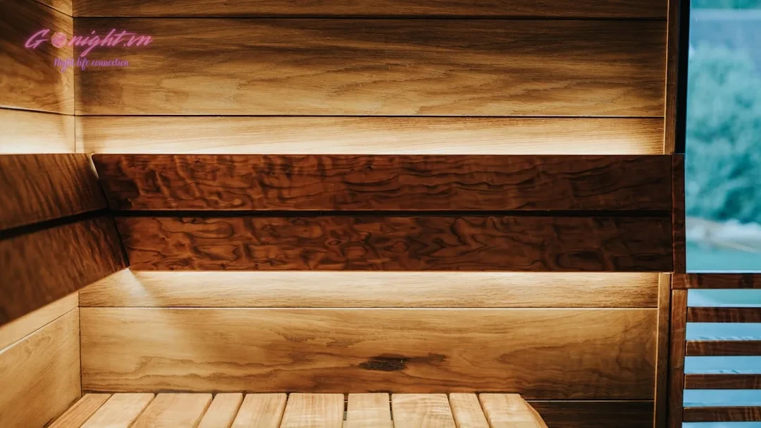 First-Timer's Guide to Nuru Massage: What to Expect and How to Choose a Reputable Spa in Vietnam 1 Warm wooden sauna with soft ambient lighting