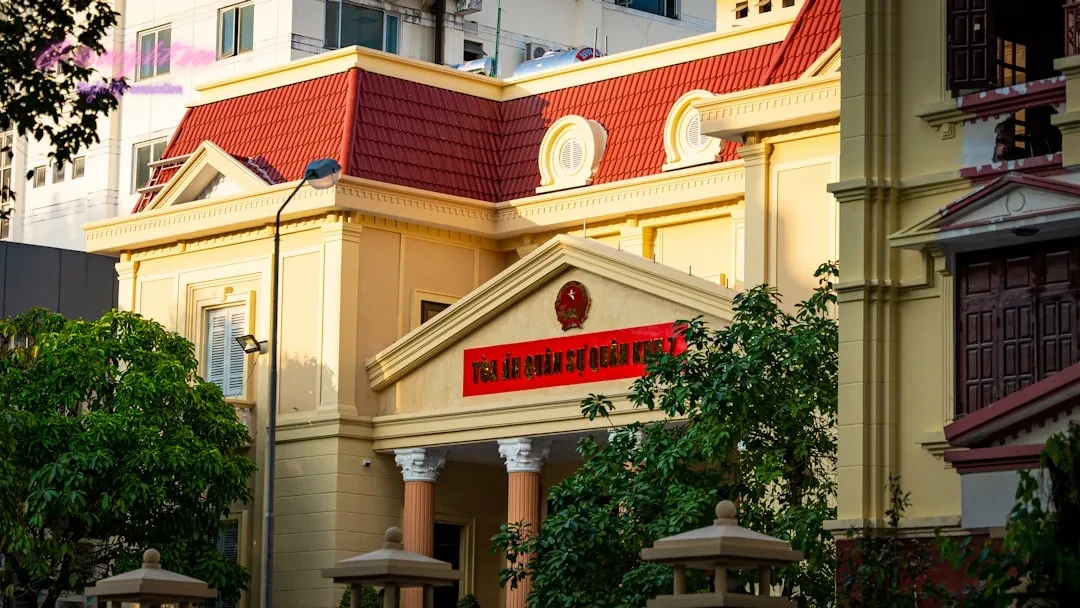 a red and white building with a red roof