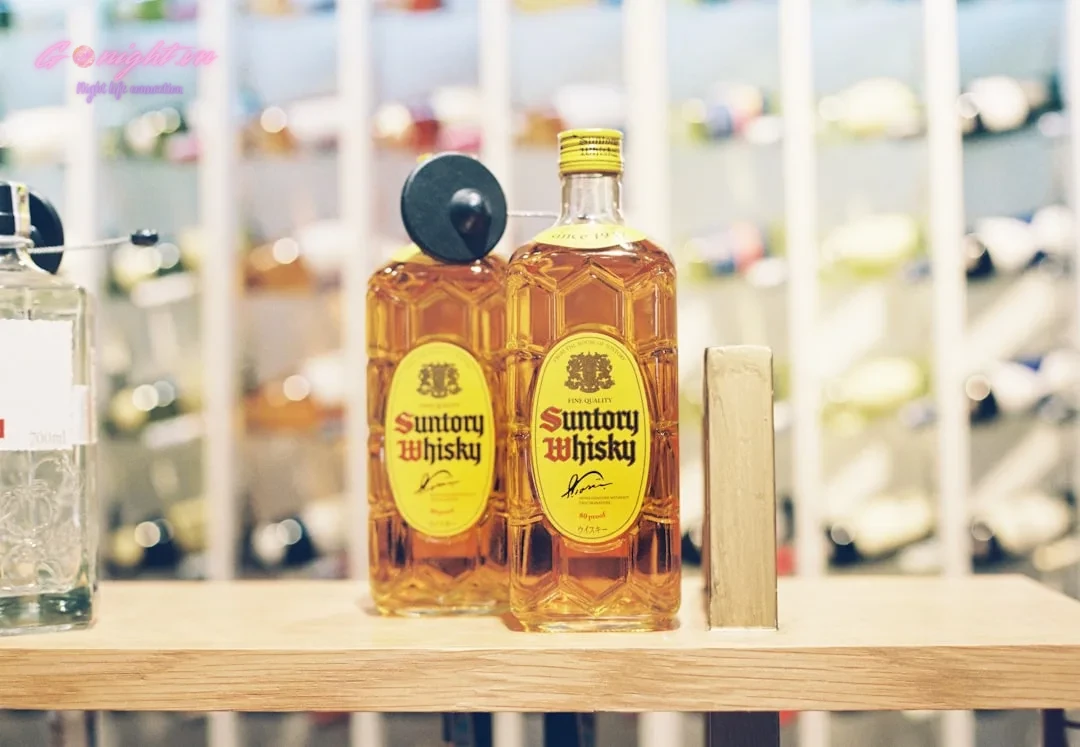 Beyond Bui Vien: Top 7 Craft Cocktail Bars in Ho Chi Minh City's District 1 for a Sophisticated Night Out 7 selective focus photography of yellow labeled bottle