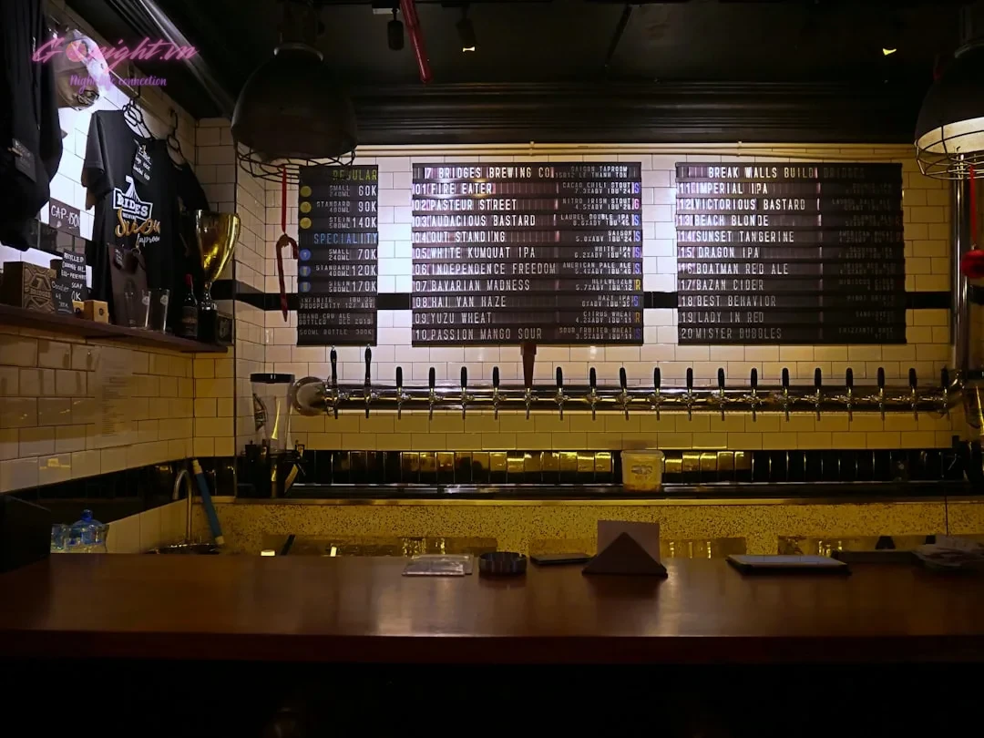 a bar with a bunch of beer bottles on it