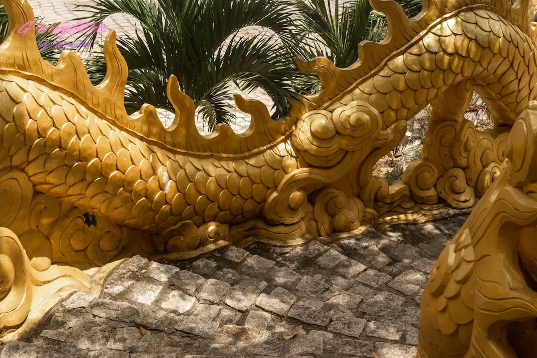 Ultimate Vietnam Travel Guide: Essential Tips and Nightlife Secrets 1 a golden dragon statue sitting on top of a stone walkway