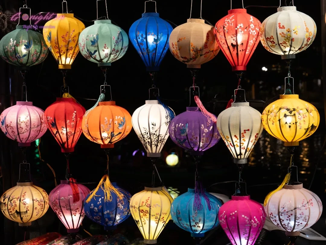 Colorful hanging lanterns illuminated at night